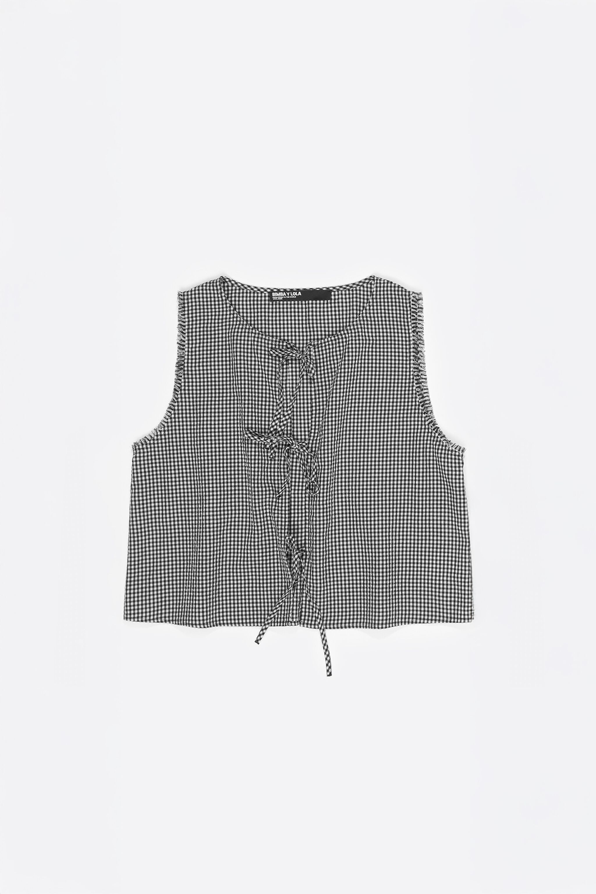 Black checked top with bows and frayed details