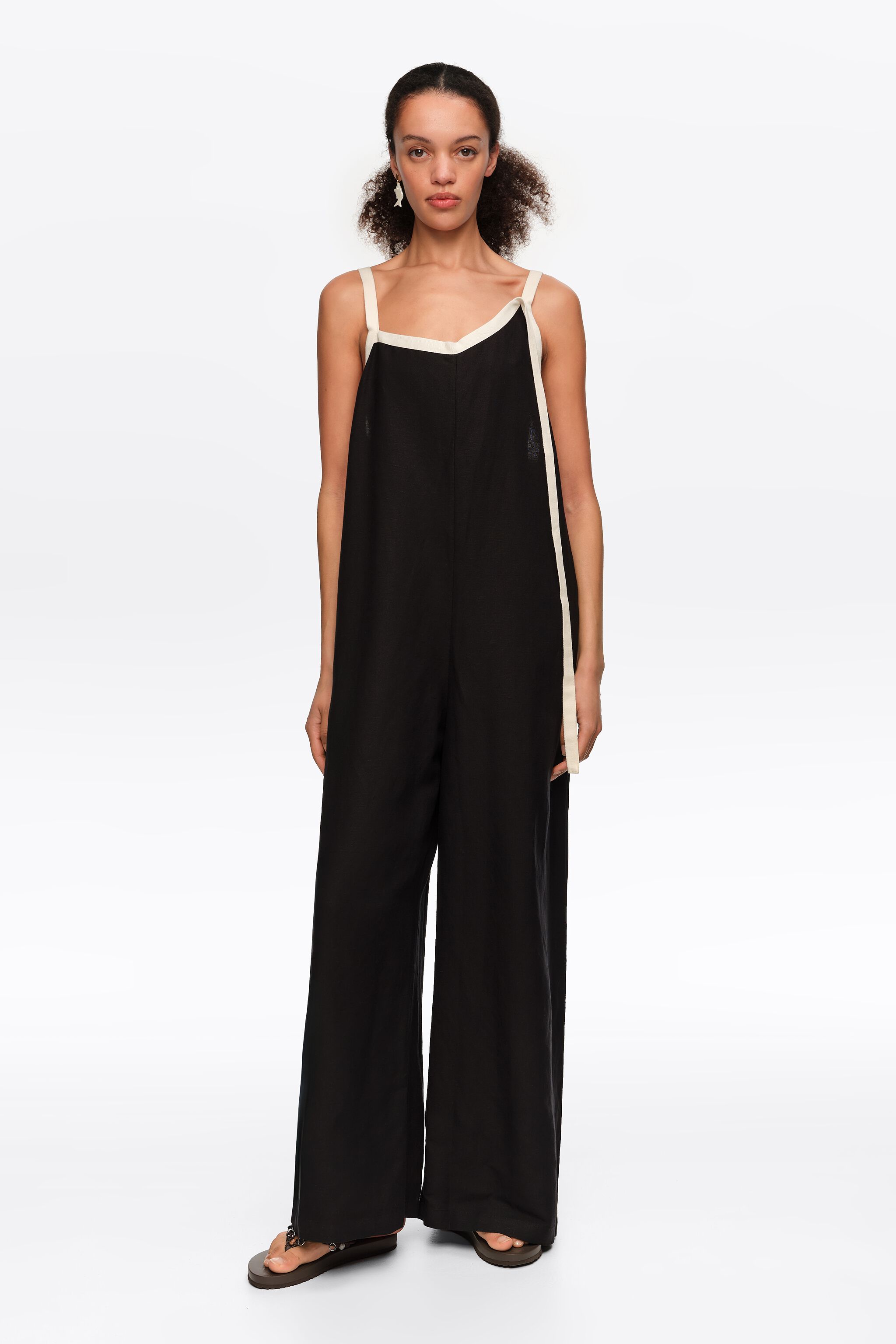 Straight black jumpsuit with contrasting straps