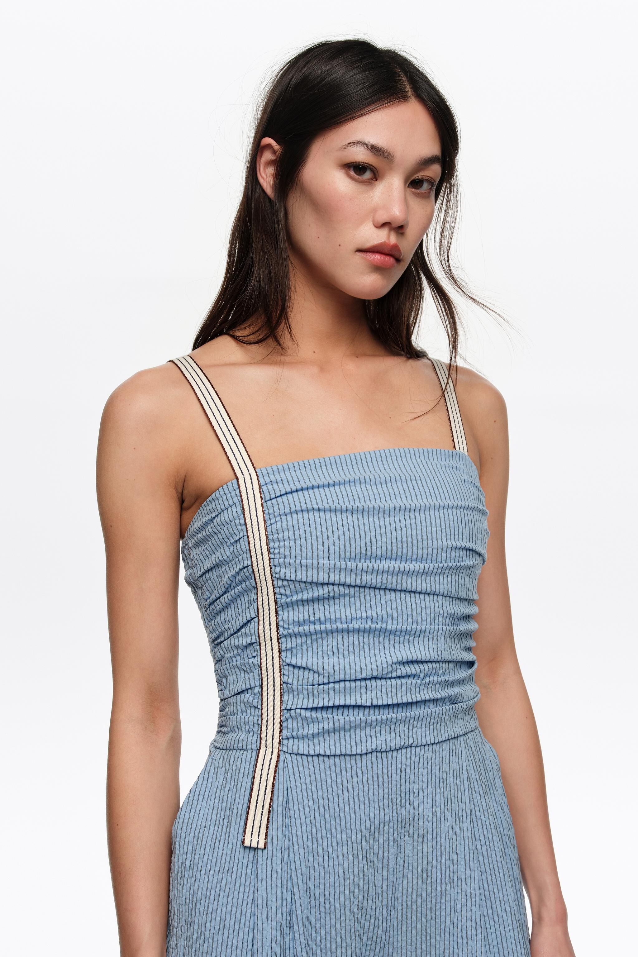 Blue striped jumpsuit with gathered straps