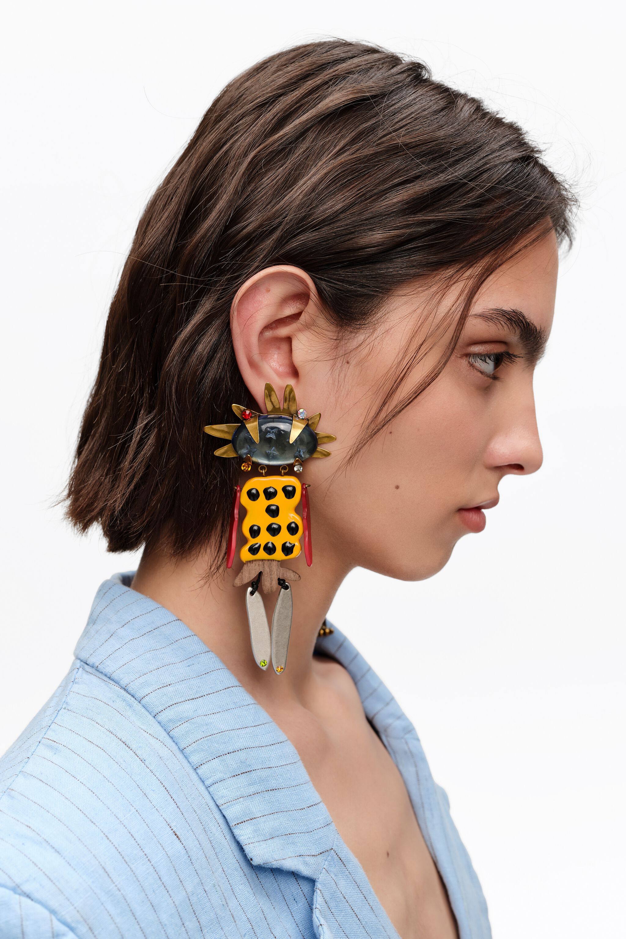 Aged gold dancer earrings