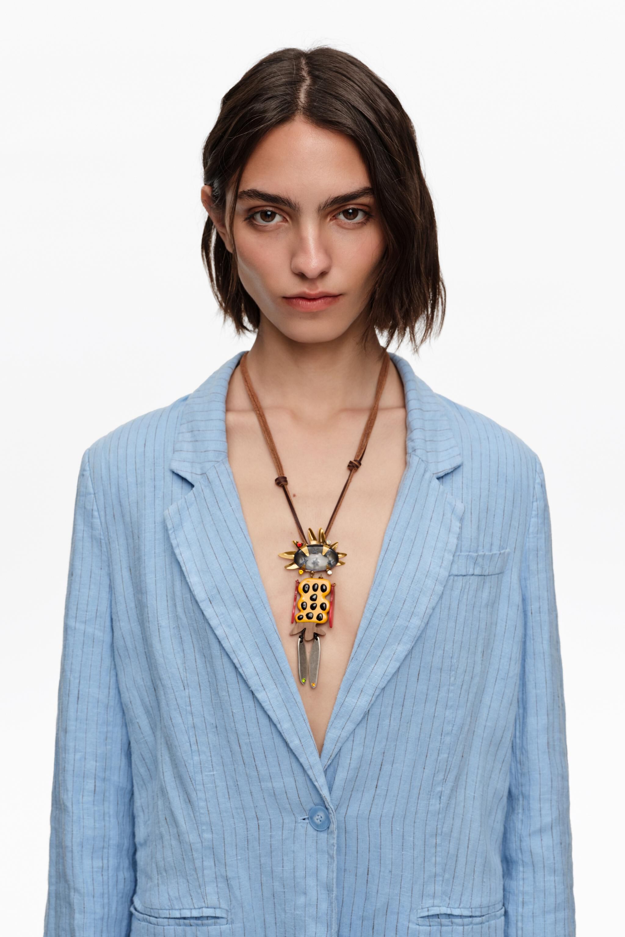 Aged gold dancer necklace