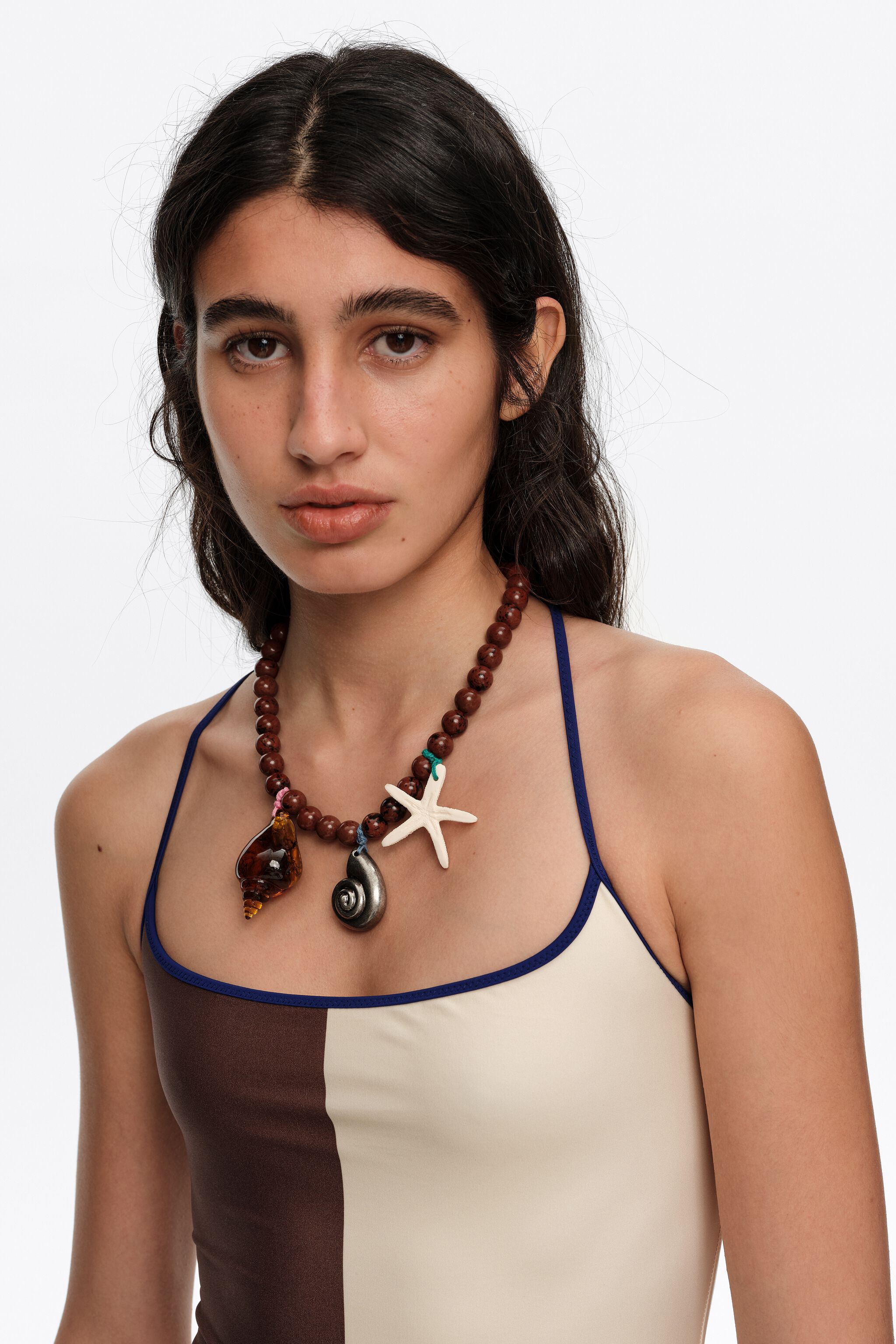 Aged silver necklace with stones and seashells