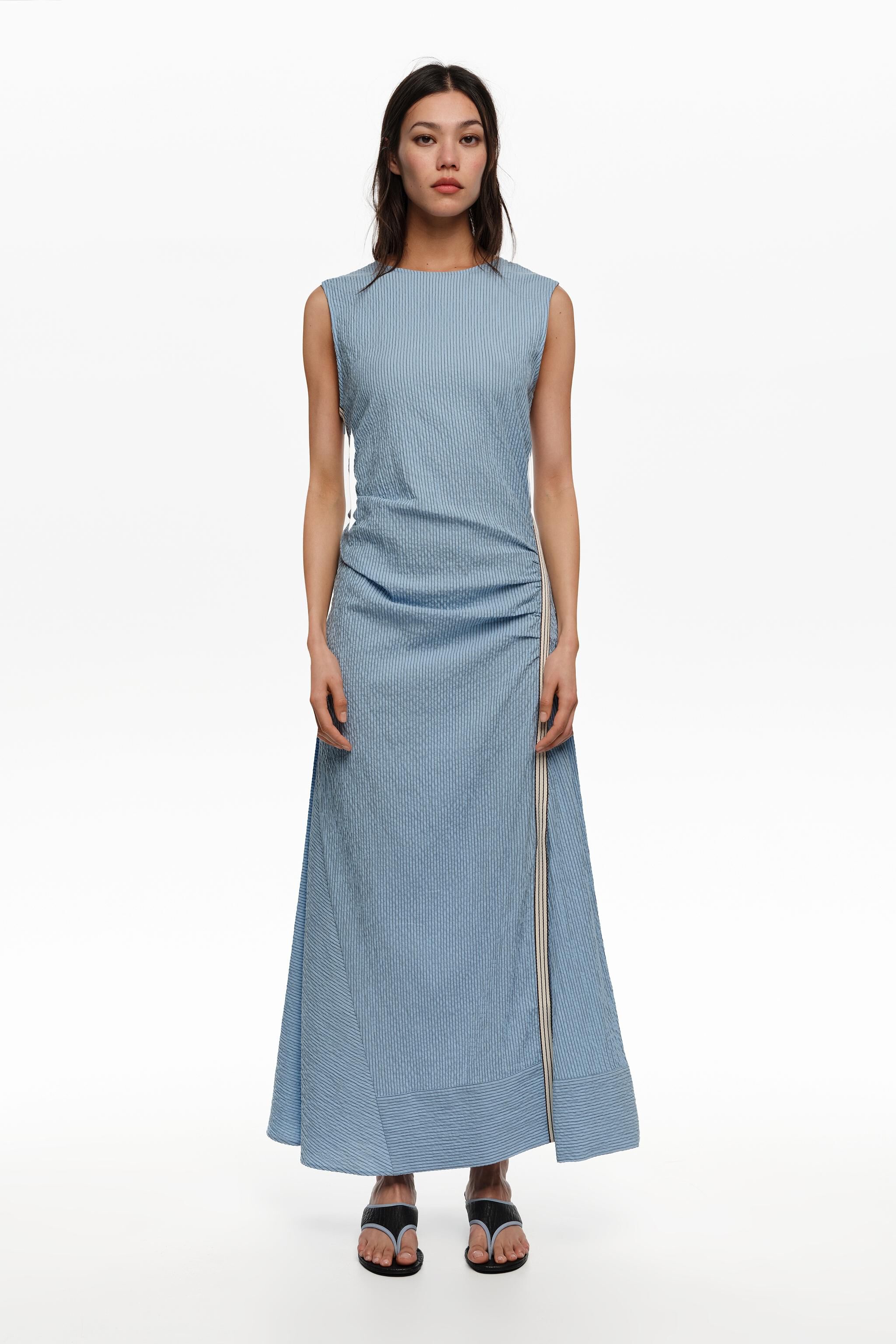 Sleeveless dress with blue striped overlay strap
