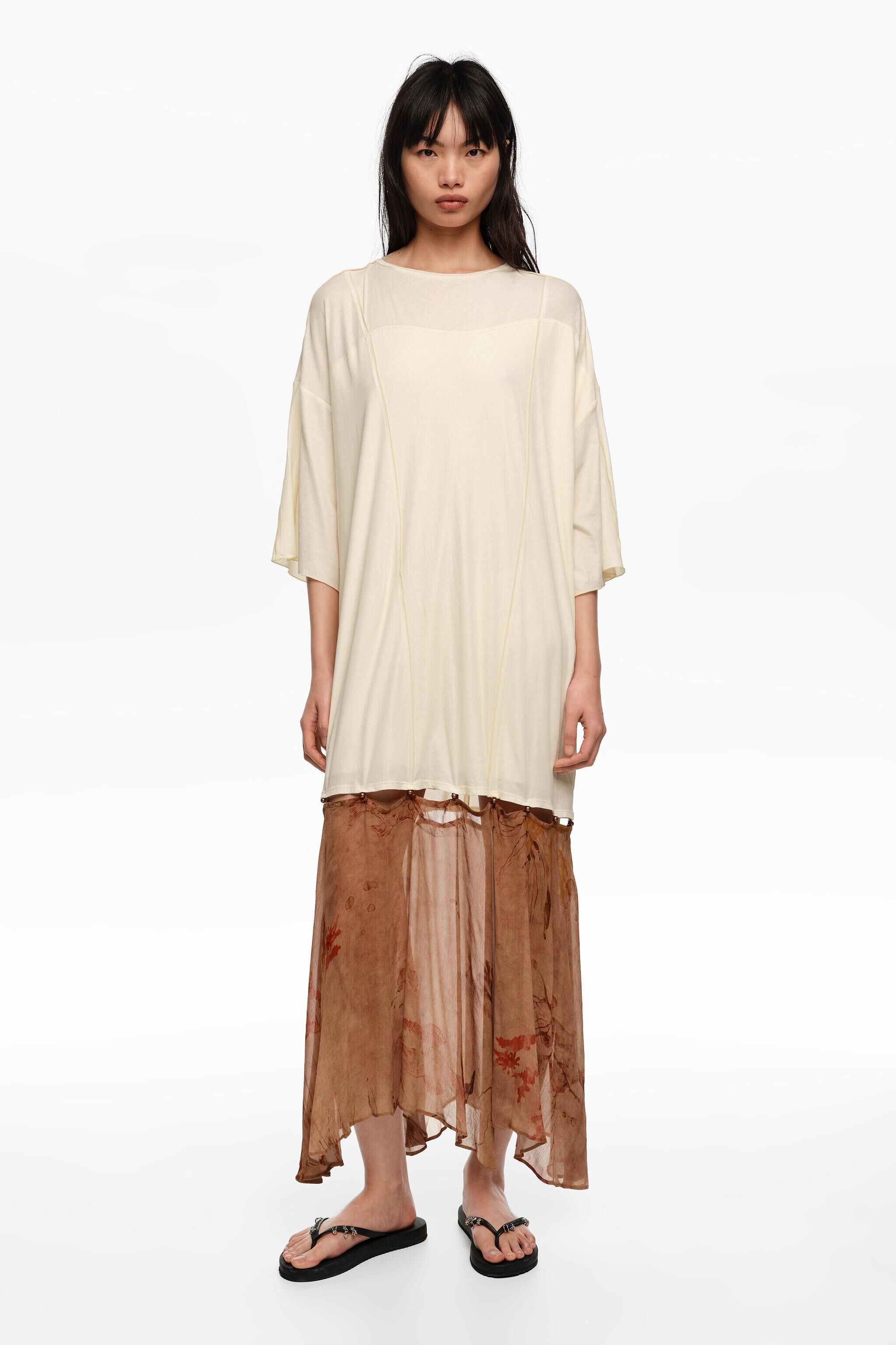 Underwater two-material dress with buttoned hem