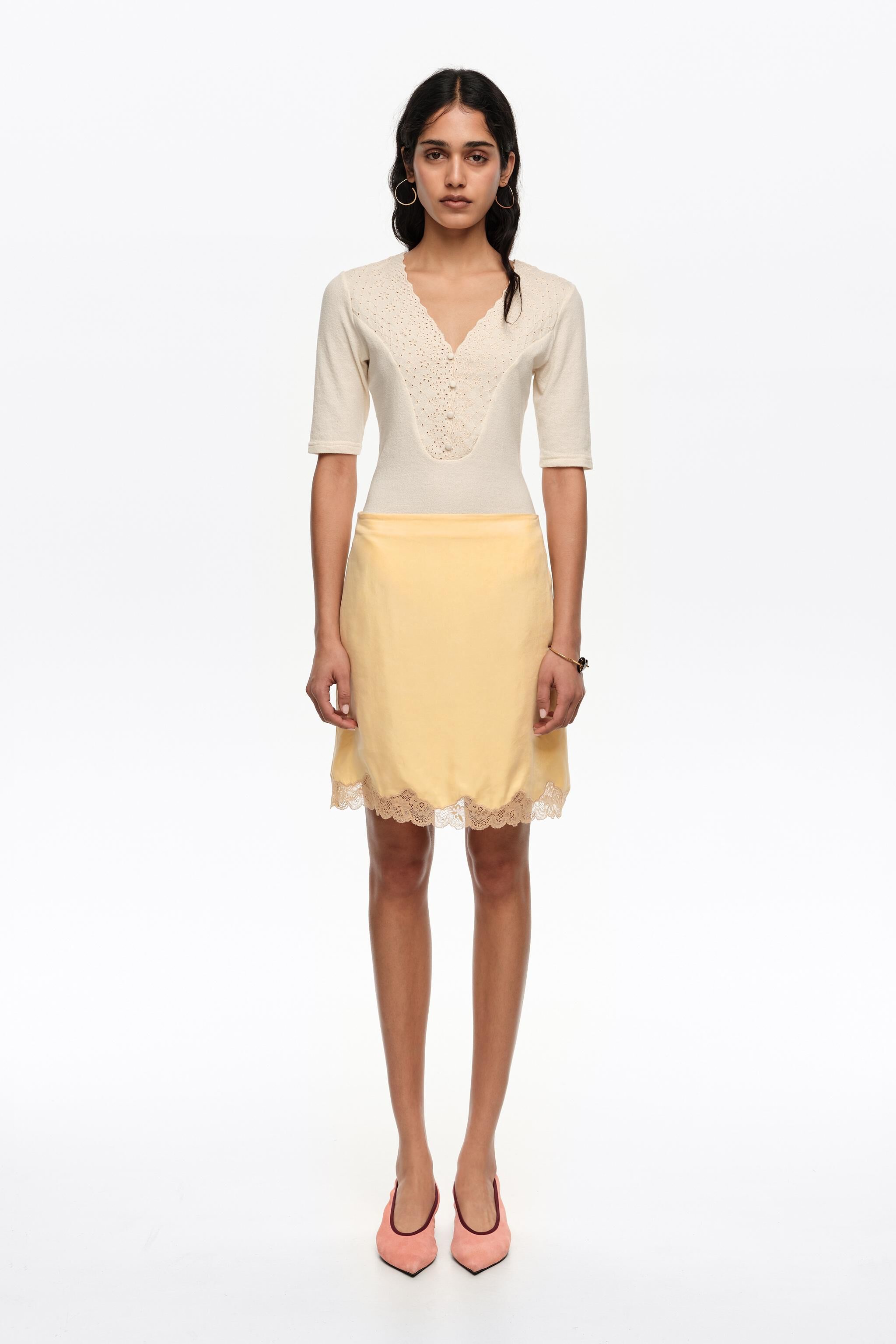 Yellow lace mini skirt